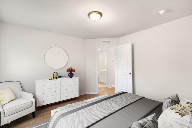 bedroom with dark hardwood / wood-style floors