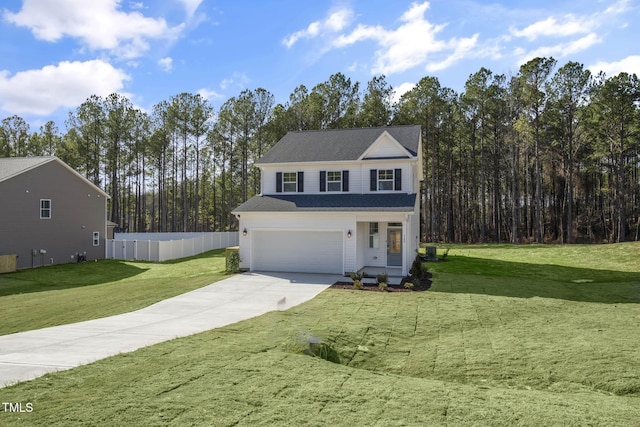 view of front property featuring a front yard and a garage