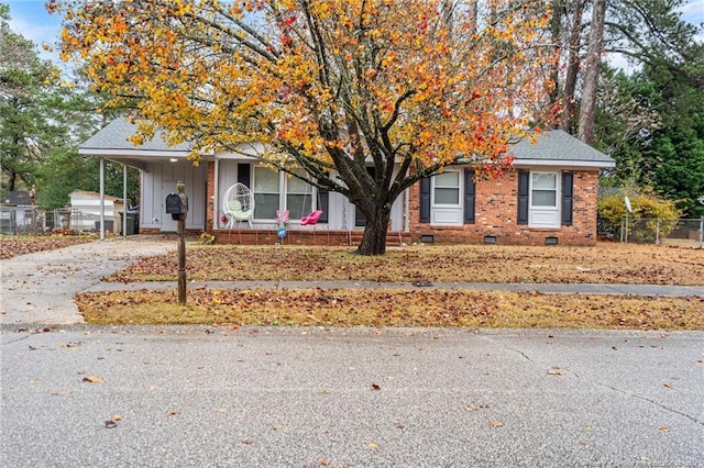 obstructed view of property featuring a carport