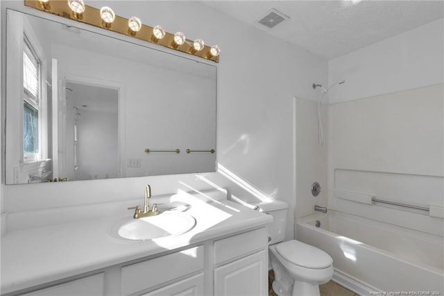 full bathroom featuring vanity, shower / bath combination, a textured ceiling, and toilet