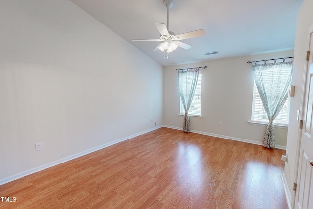 unfurnished room with light wood-type flooring, vaulted ceiling, and ceiling fan