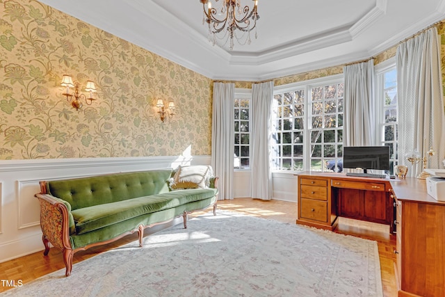 home office featuring a raised ceiling, crown molding, and plenty of natural light