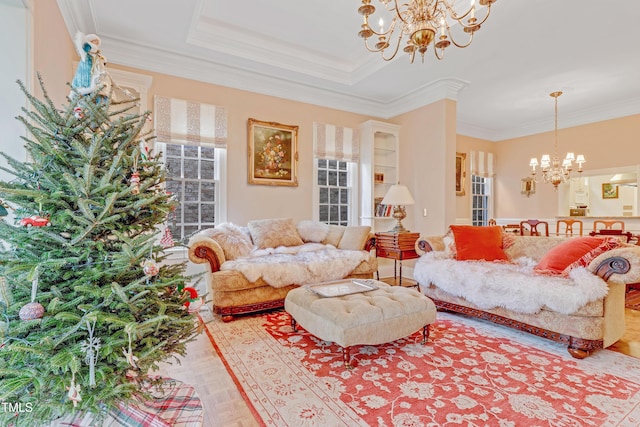 living room with crown molding and a notable chandelier