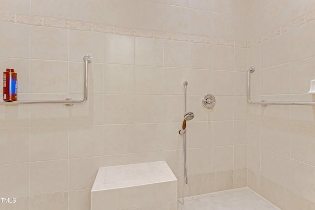 bathroom with tiled shower