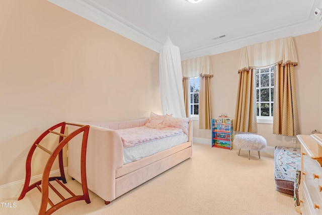 bedroom featuring ornamental molding and carpet floors