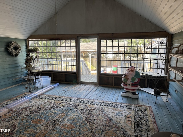 unfurnished sunroom with lofted ceiling and a healthy amount of sunlight