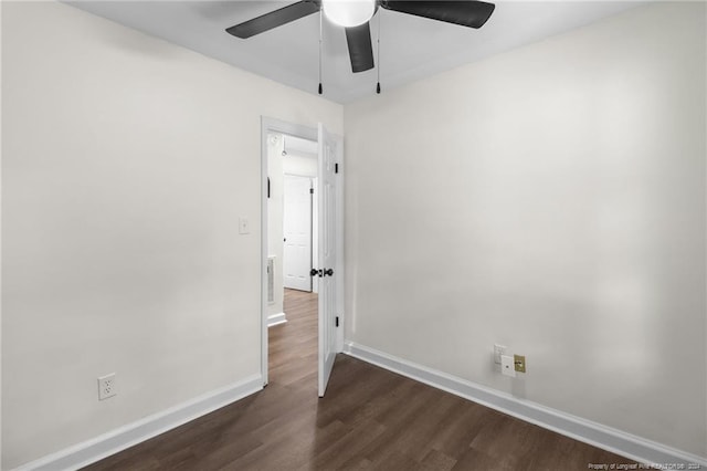 spare room featuring ceiling fan and dark hardwood / wood-style flooring