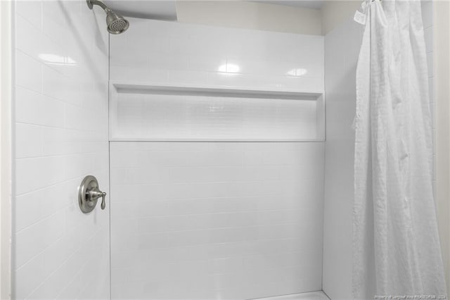 bathroom with a shower with curtain