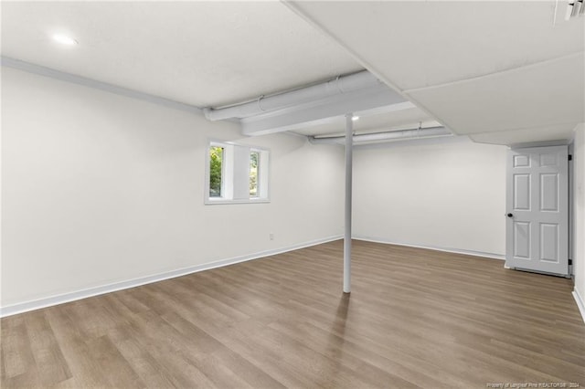 basement featuring hardwood / wood-style flooring