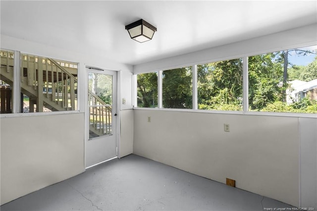 unfurnished sunroom with plenty of natural light