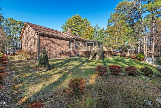 view of yard featuring stairs and a wooden deck