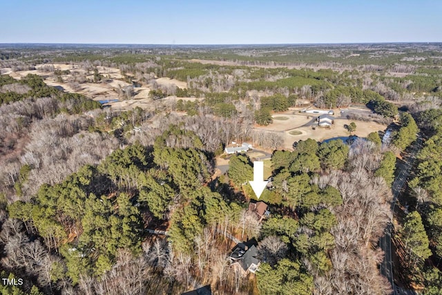 bird's eye view featuring a wooded view