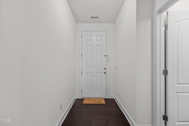 doorway to outside with dark wood-type flooring