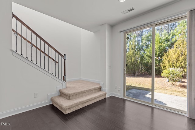 interior space with dark hardwood / wood-style floors