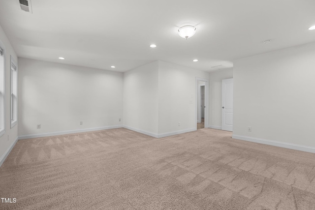 empty room featuring light carpet