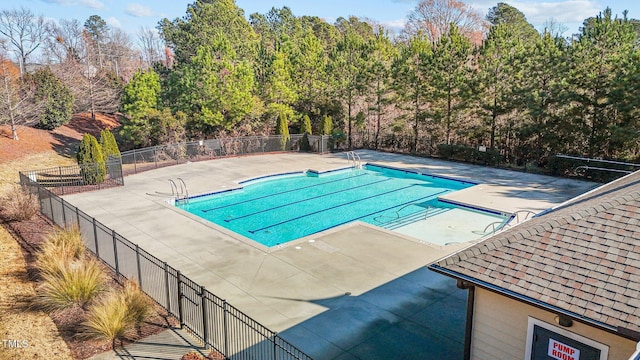 view of swimming pool with a patio