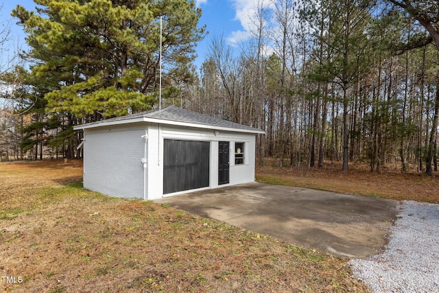 garage featuring a yard