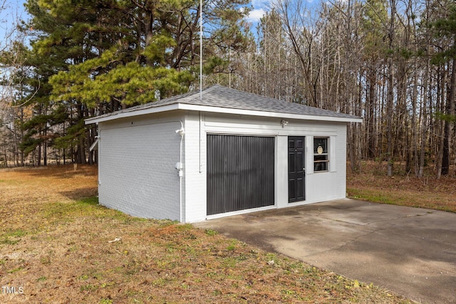 view of outbuilding featuring a lawn