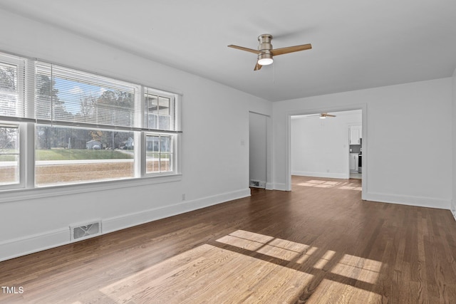 unfurnished room featuring dark hardwood / wood-style flooring