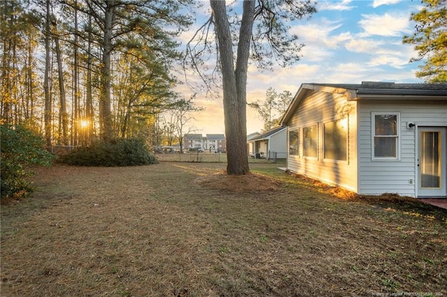 view of yard at dusk