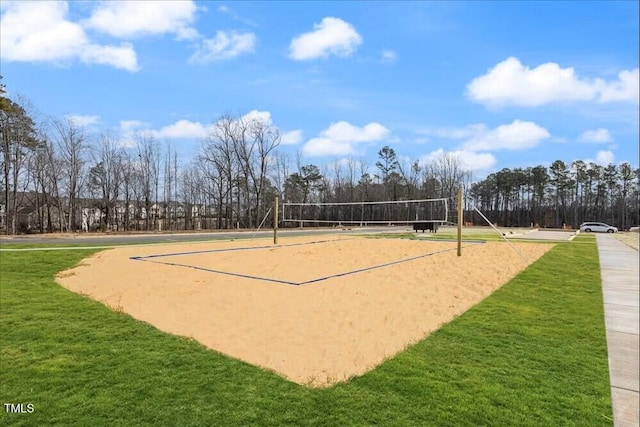 surrounding community featuring a lawn and volleyball court