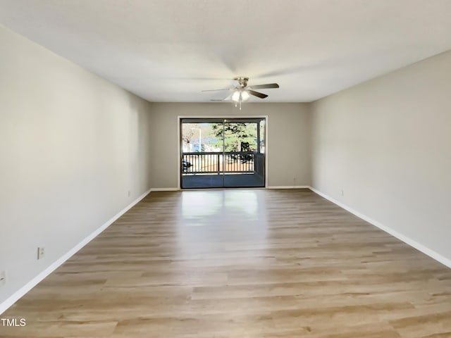 empty room with light hardwood / wood-style flooring and ceiling fan