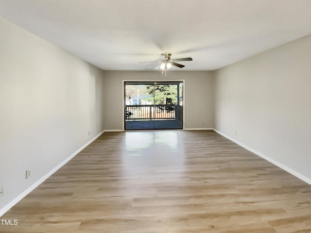 5038 Flint Ridge Pl, Raleigh, NC 27609 - empty room featuring a ceiling fan and wood finished floors