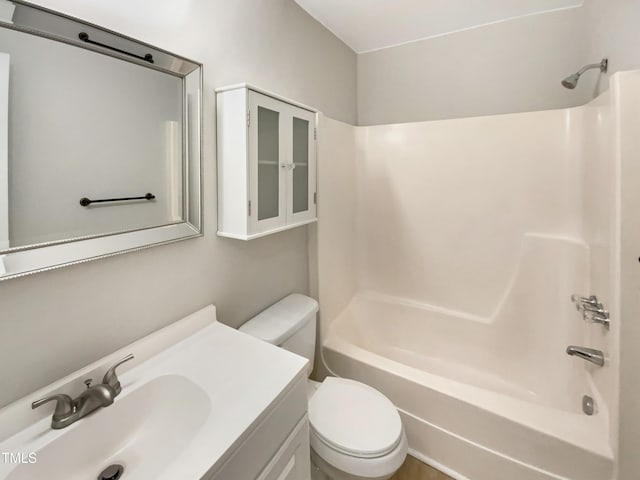 full bathroom with vanity,  shower combination, and toilet