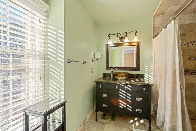 bathroom with curtained shower and vanity