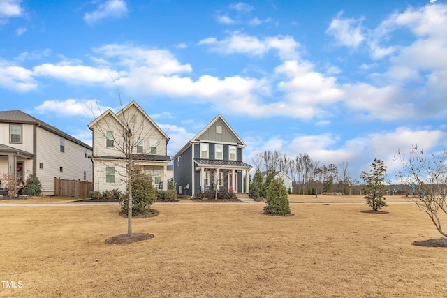 view of front of house with a porch and a front lawn