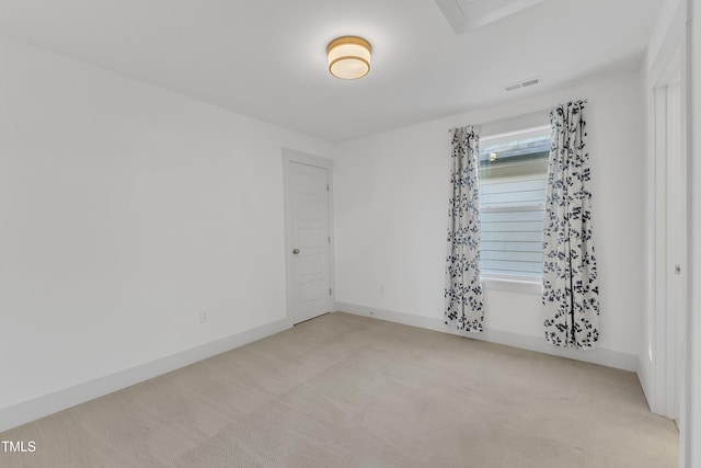 empty room featuring light colored carpet