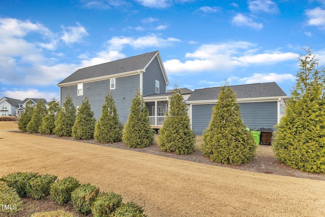 view of side of property featuring a sunroom