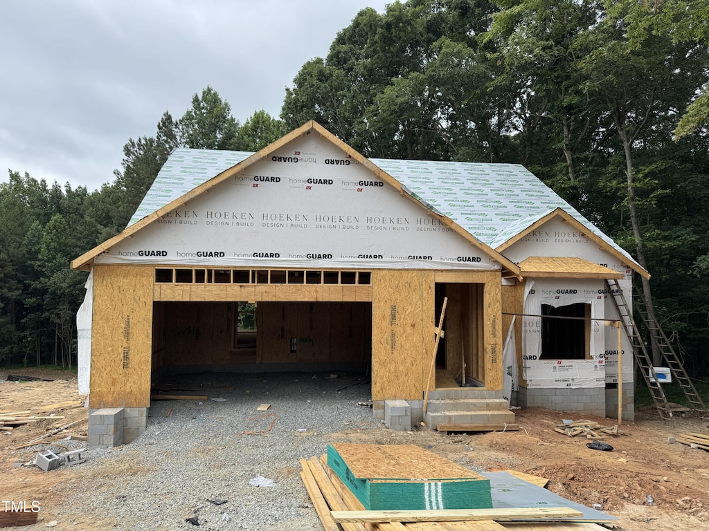 LOT67 Sage Ct, Fuquay Varina, NC 27526 - unfinished property featuring an outdoor structure and a garage