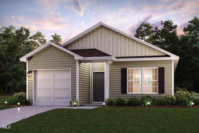 view of front facade with a garage and a yard