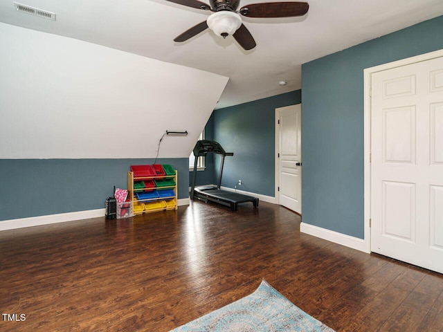 playroom featuring ceiling fan, lofted ceiling, and dark wood-type flooring