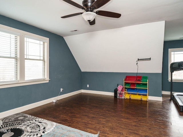 rec room featuring dark hardwood / wood-style floors, ceiling fan, and lofted ceiling