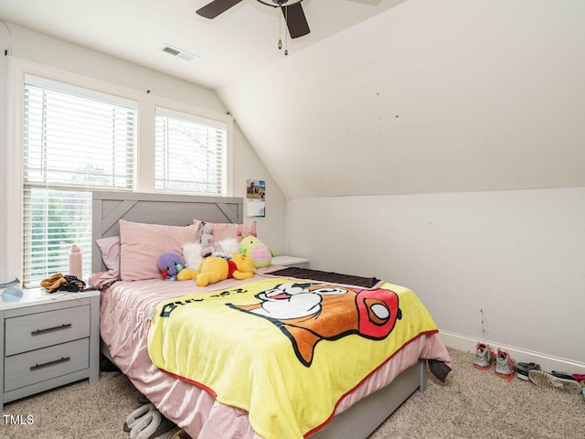 carpeted bedroom with ceiling fan, lofted ceiling, and multiple windows