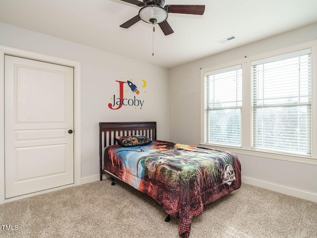 carpeted bedroom with ceiling fan