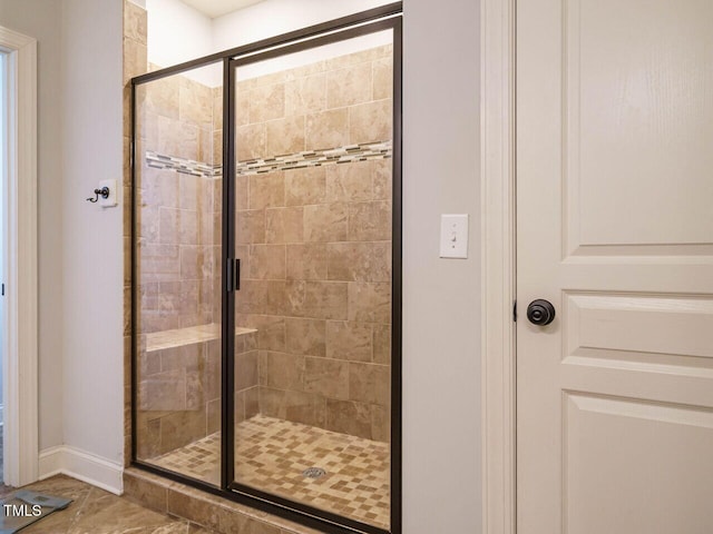 bathroom featuring an enclosed shower