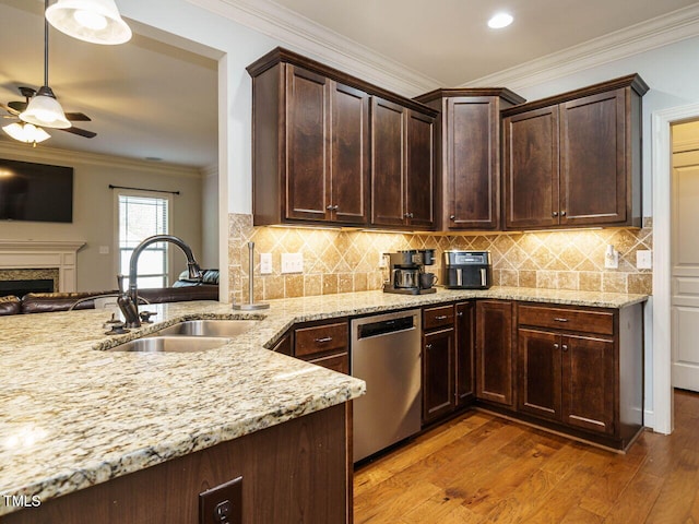 kitchen featuring hardwood / wood-style floors, dishwasher, sink, ceiling fan, and ornamental molding