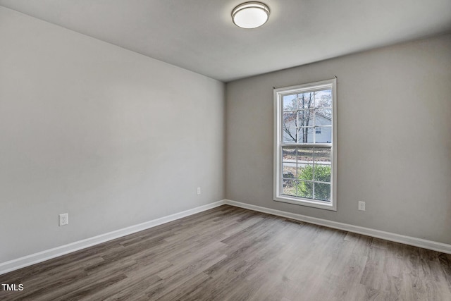 spare room with light wood-type flooring