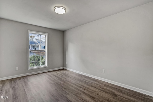 spare room with hardwood / wood-style flooring