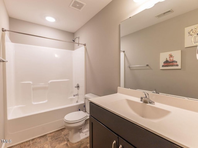 full bathroom with shower / tub combination, vanity, and toilet