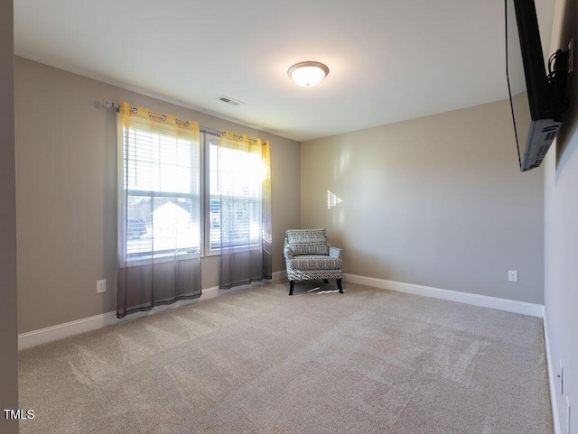 sitting room with light colored carpet