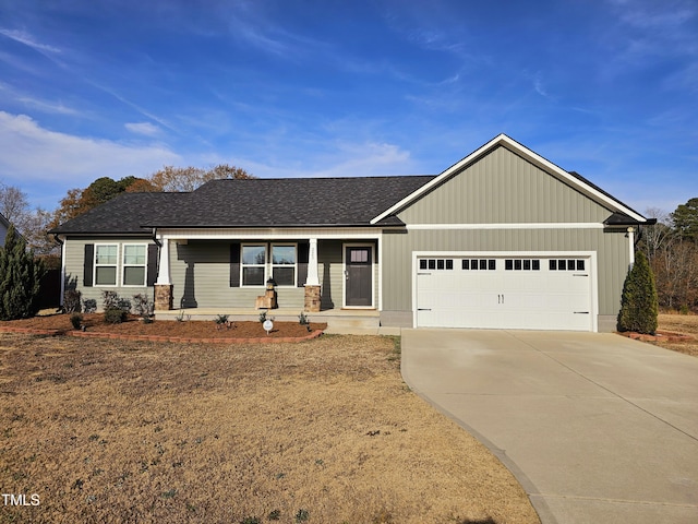 view of front facade featuring a porch and a garage