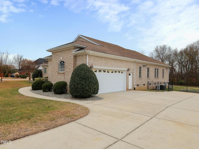 view of home's exterior featuring a garage and a lawn