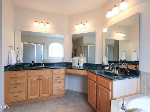 bathroom with tile patterned flooring, vanity, and shower with separate bathtub