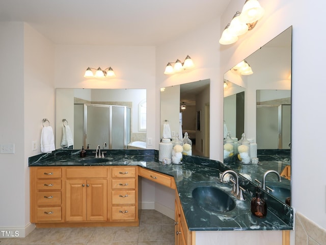 bathroom featuring vanity, tile patterned floors, a shower with door, and ceiling fan