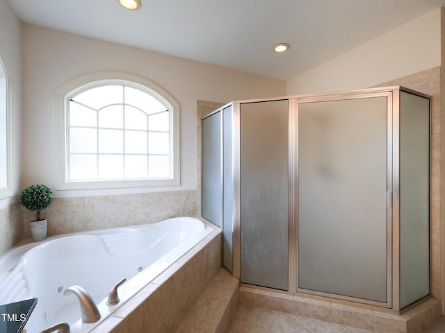 bathroom featuring tile patterned flooring and independent shower and bath