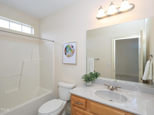 full bathroom with bathtub / shower combination, vanity, and toilet